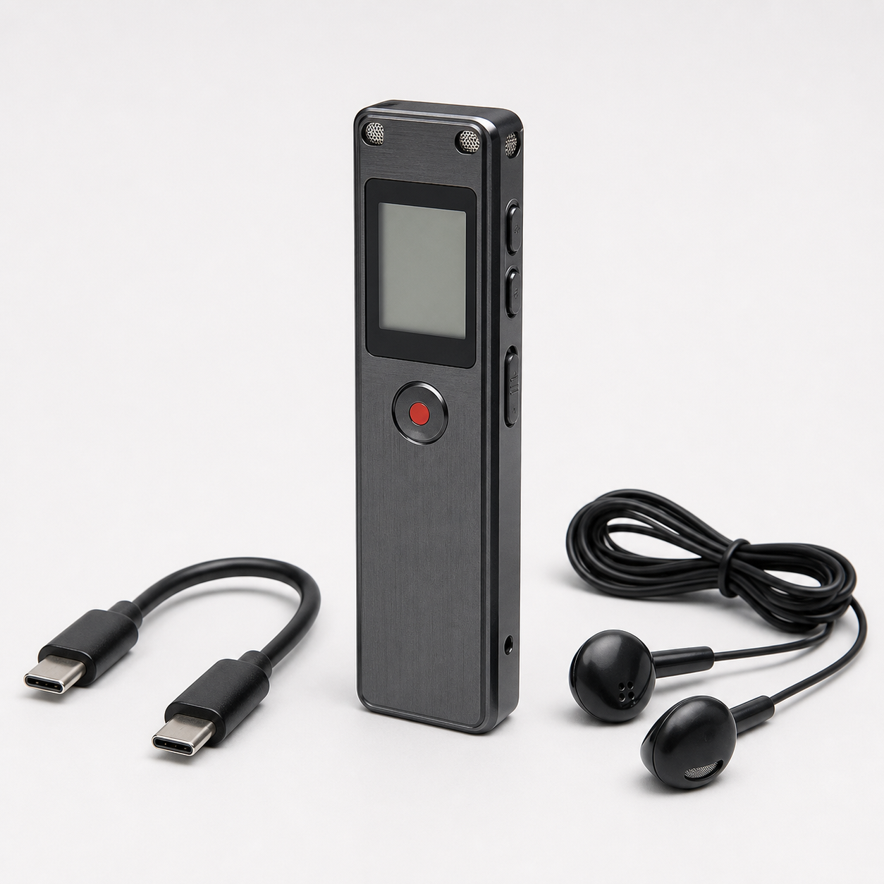 Unbranded graphite digital voice recorder with blank screen, red record button, USB-C cable, and wired earbuds