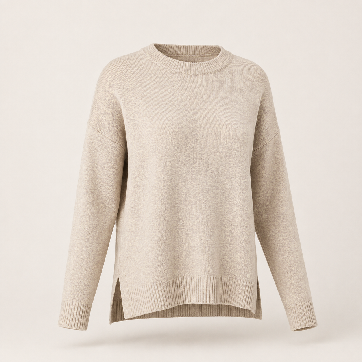 Oatmeal beige women's drop-shoulder crew-neck knit sweater with a relaxed shape and side-split hem