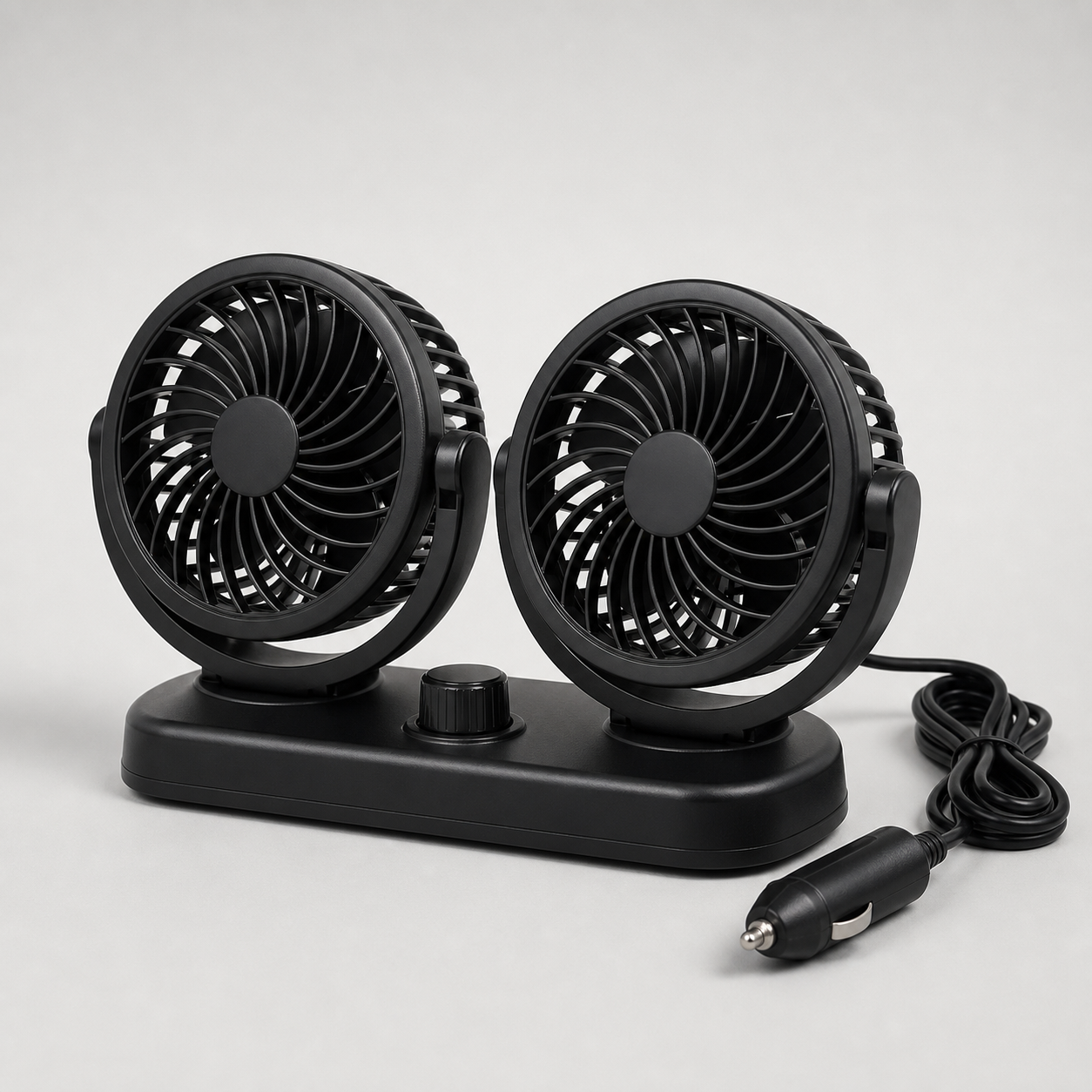Unbranded black dual-head car cooling fan with two adjustable grilles, dashboard base, speed knob, cable, and 12-volt plug