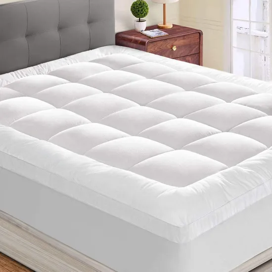 Unbranded white extra-thick down-alternative quilted mattress topper displayed on a bed