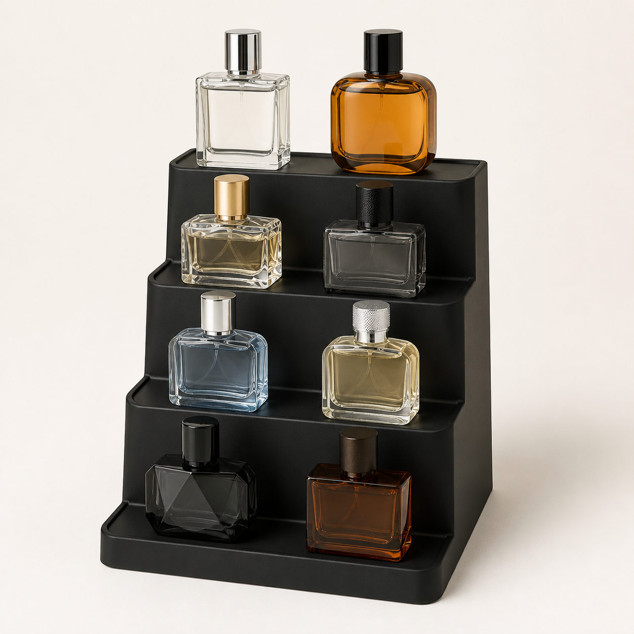 Black four-tier countertop display stand holding assorted unbranded fragrance bottles