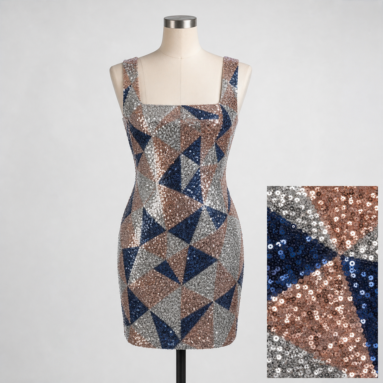 Unbranded sleeveless fitted mini party dress with geometric silver, rose-gold, and midnight-blue sequins on a torso mannequin