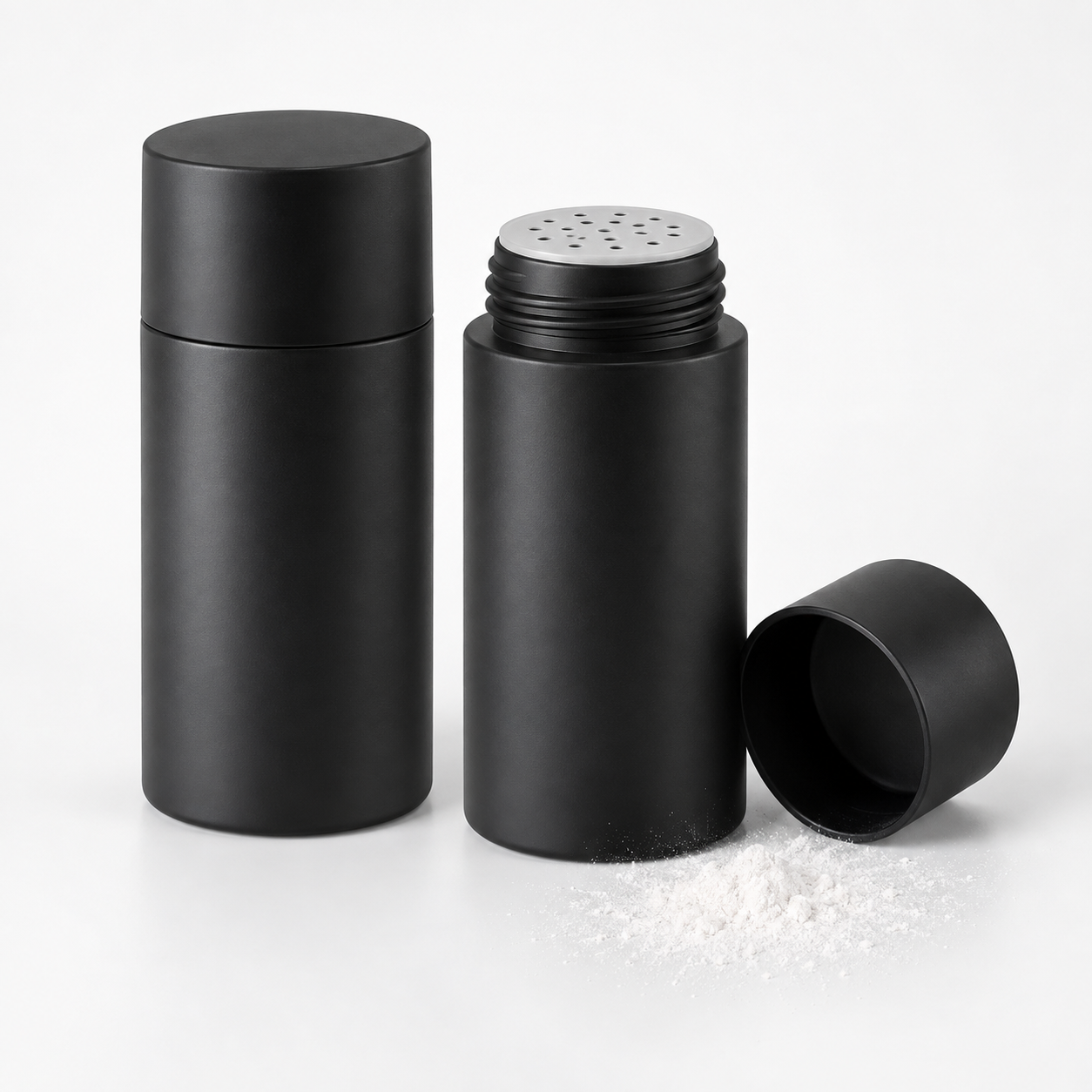 Illustrative matte black hair texture powder jars with an open shaker top and loose white styling powder