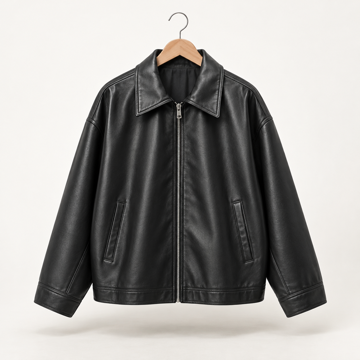 Black oversized faux leather jacket wholesale with zipper, collar, and side pockets