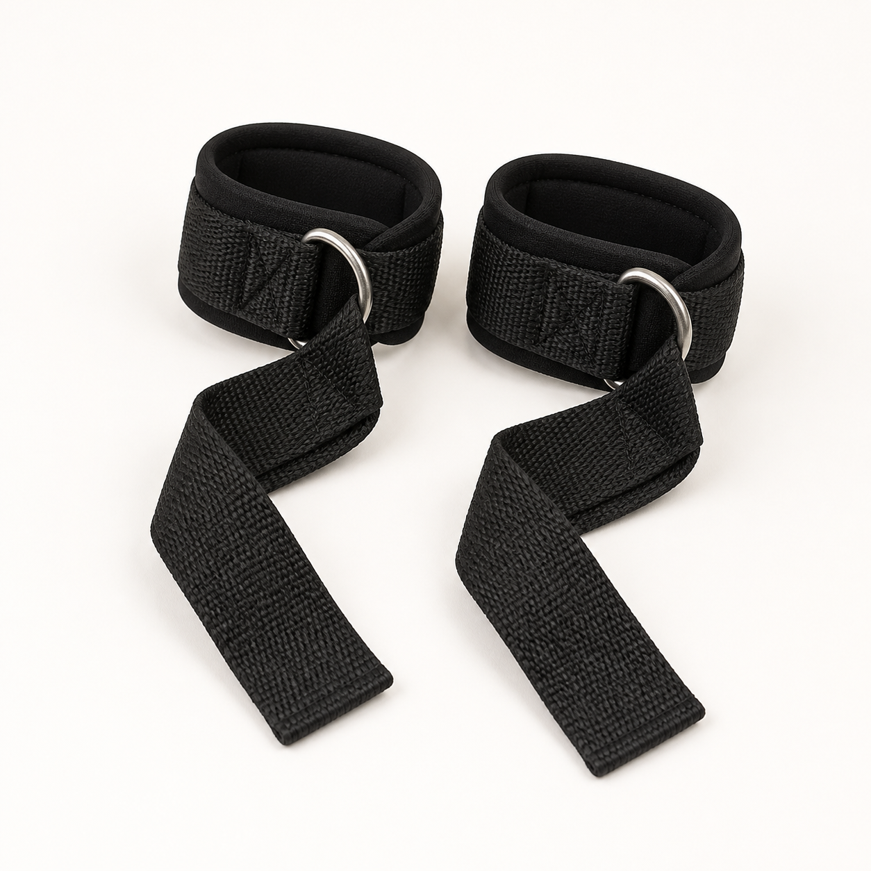 Pair of black padded D-ring weightlifting wrist straps with long woven grip tails