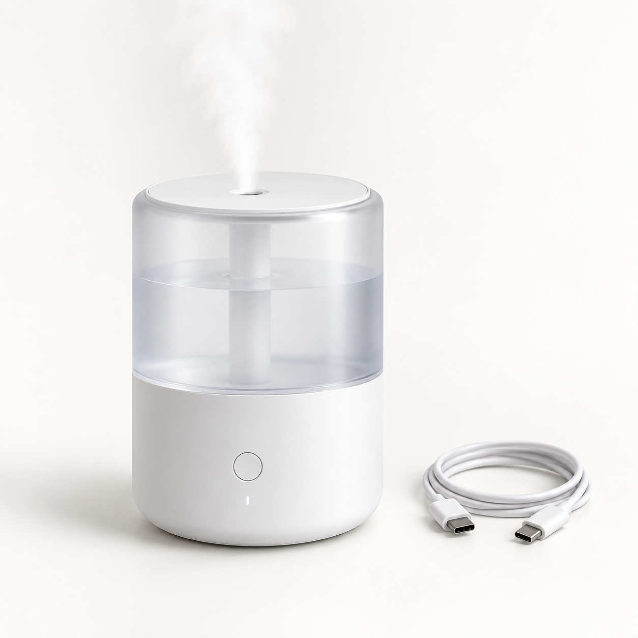 Compact white portable cool-mist humidifier with translucent tank and USB-C cable