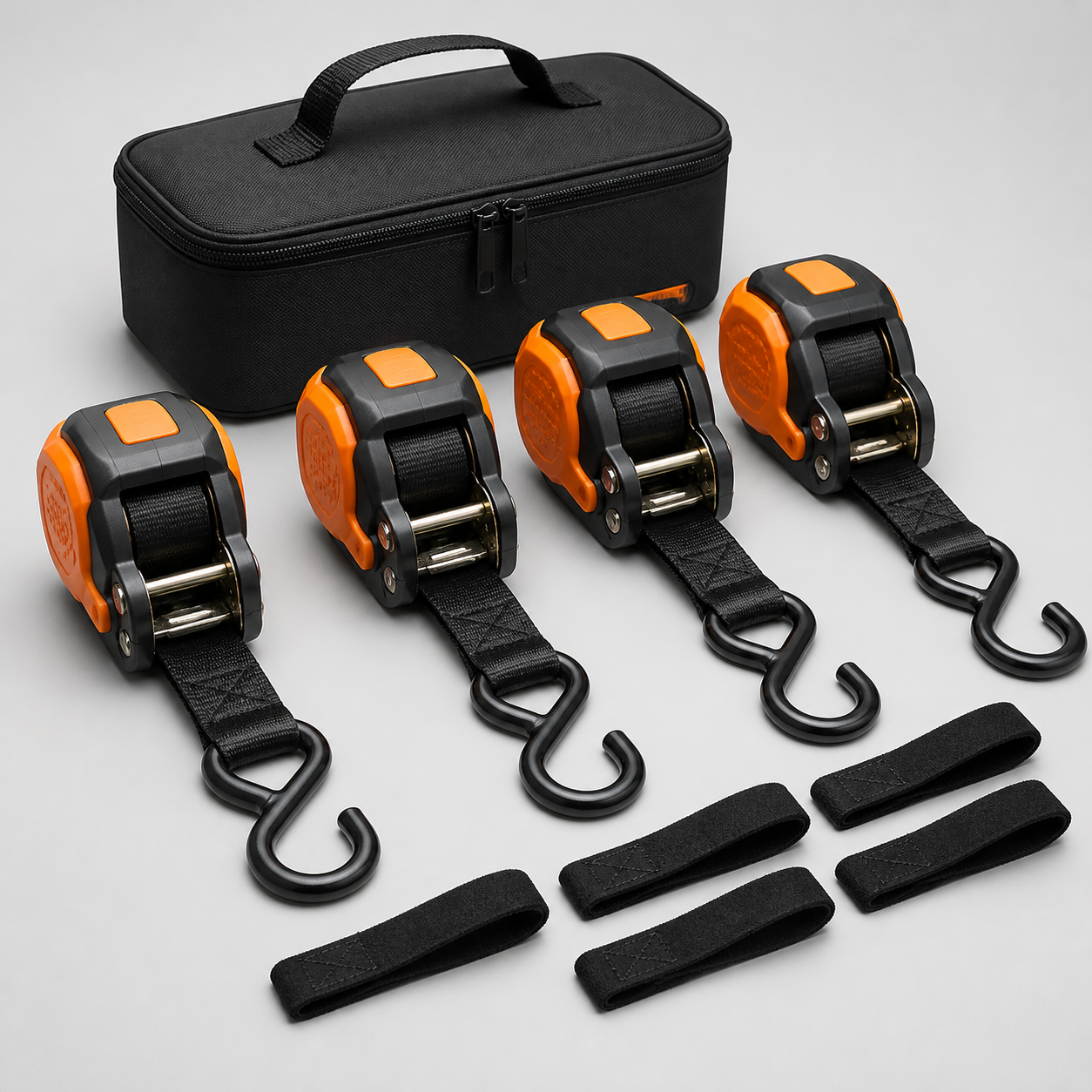 Four unbranded orange and black self-retracting ratchet straps with hooks, soft-loop accessories, and storage bag
