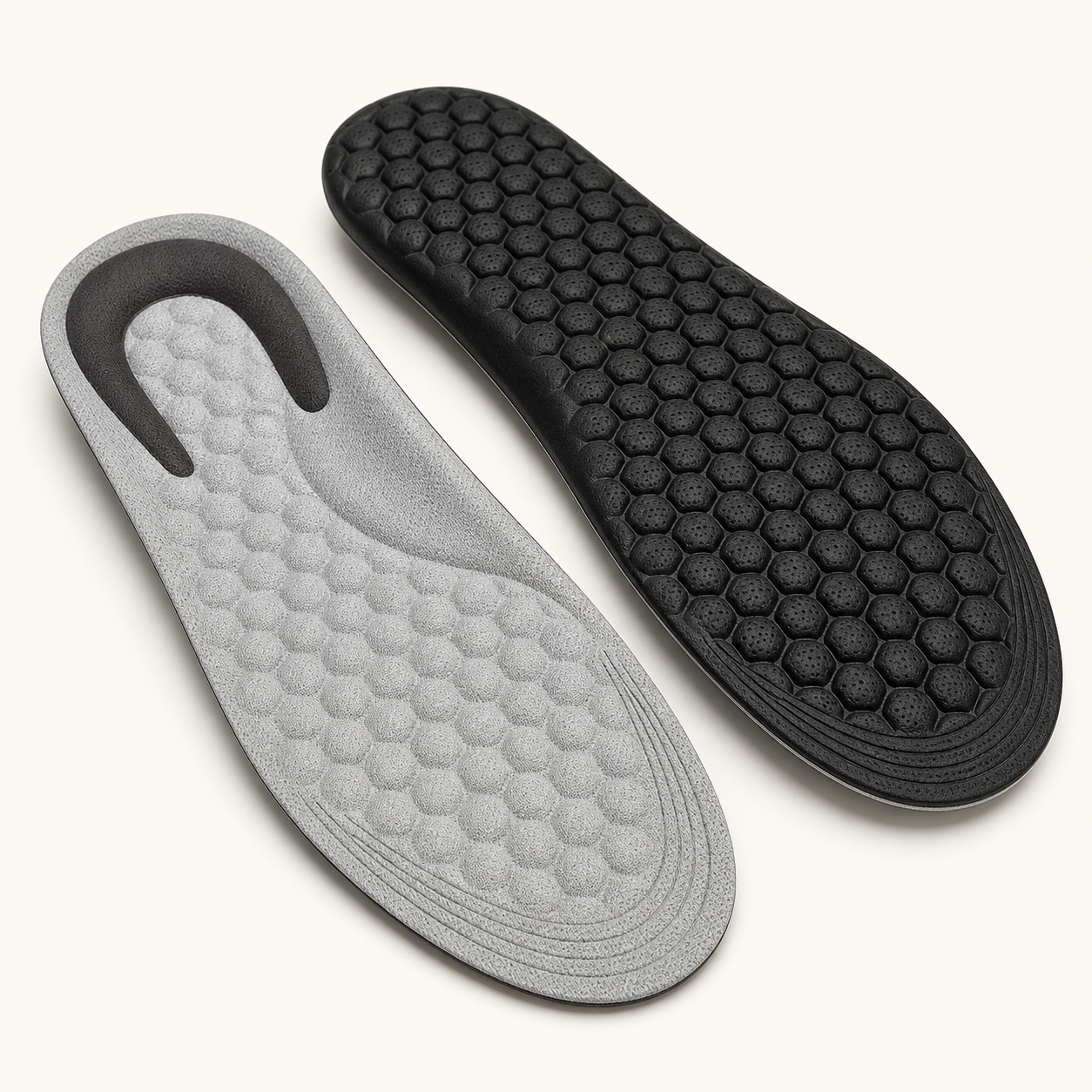 Pair of gray and black trim-to-fit cloud cushioning insoles with cut guide lines
