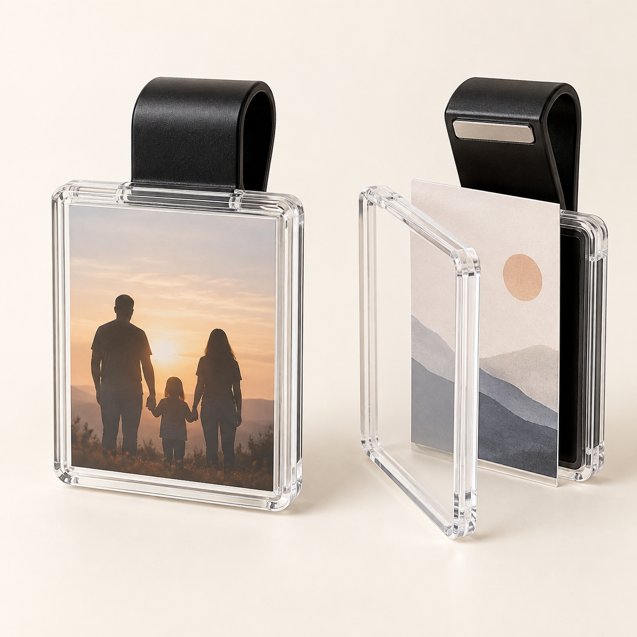 Illustrative pair of black magnetic car visor photo clips with clear square frames and sample picture inserts