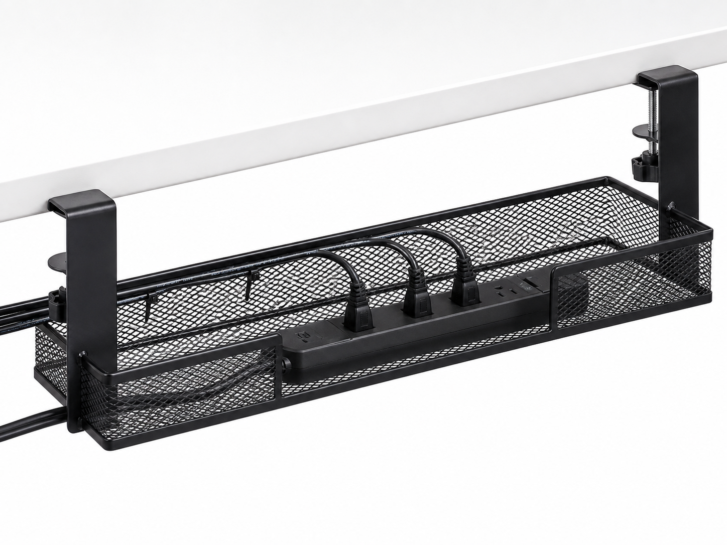 Black clamp-on under-desk cable management tray holding a power strip and organized cords