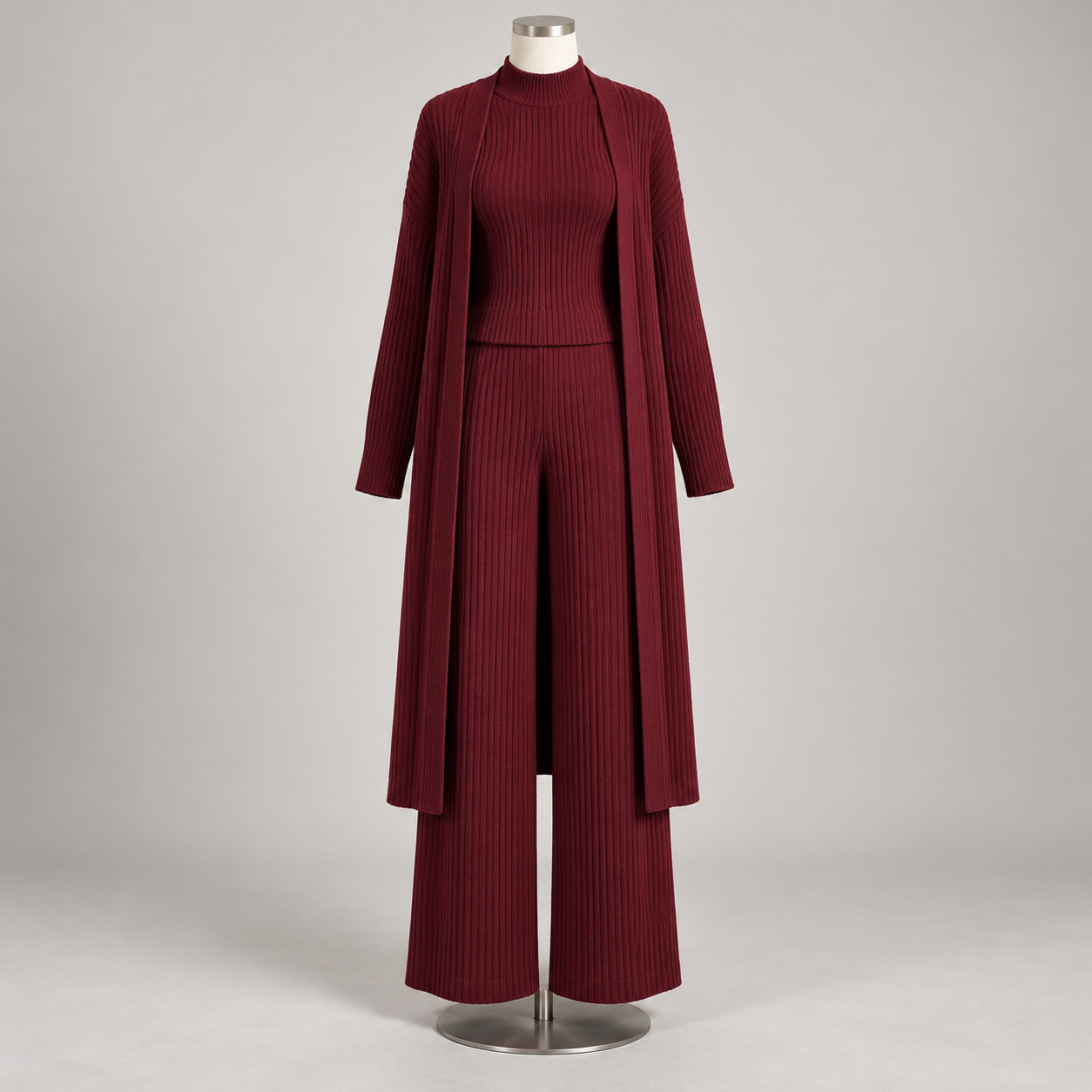 Burgundy women's three-piece ribbed knit set with cardigan, sleeveless top, and wide-leg pants